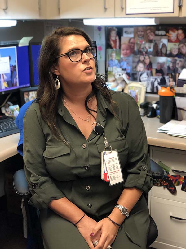 Tracy Brinley seated in her office