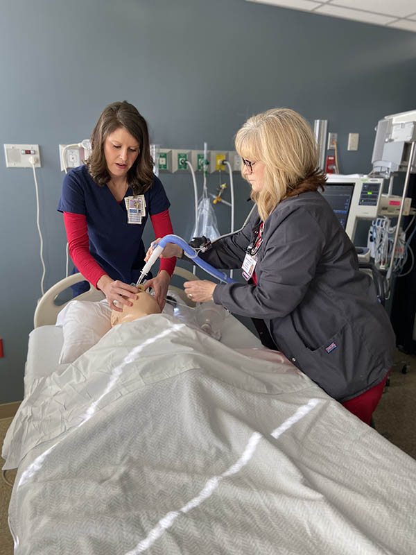 Annette monitors the patient’s ventilator